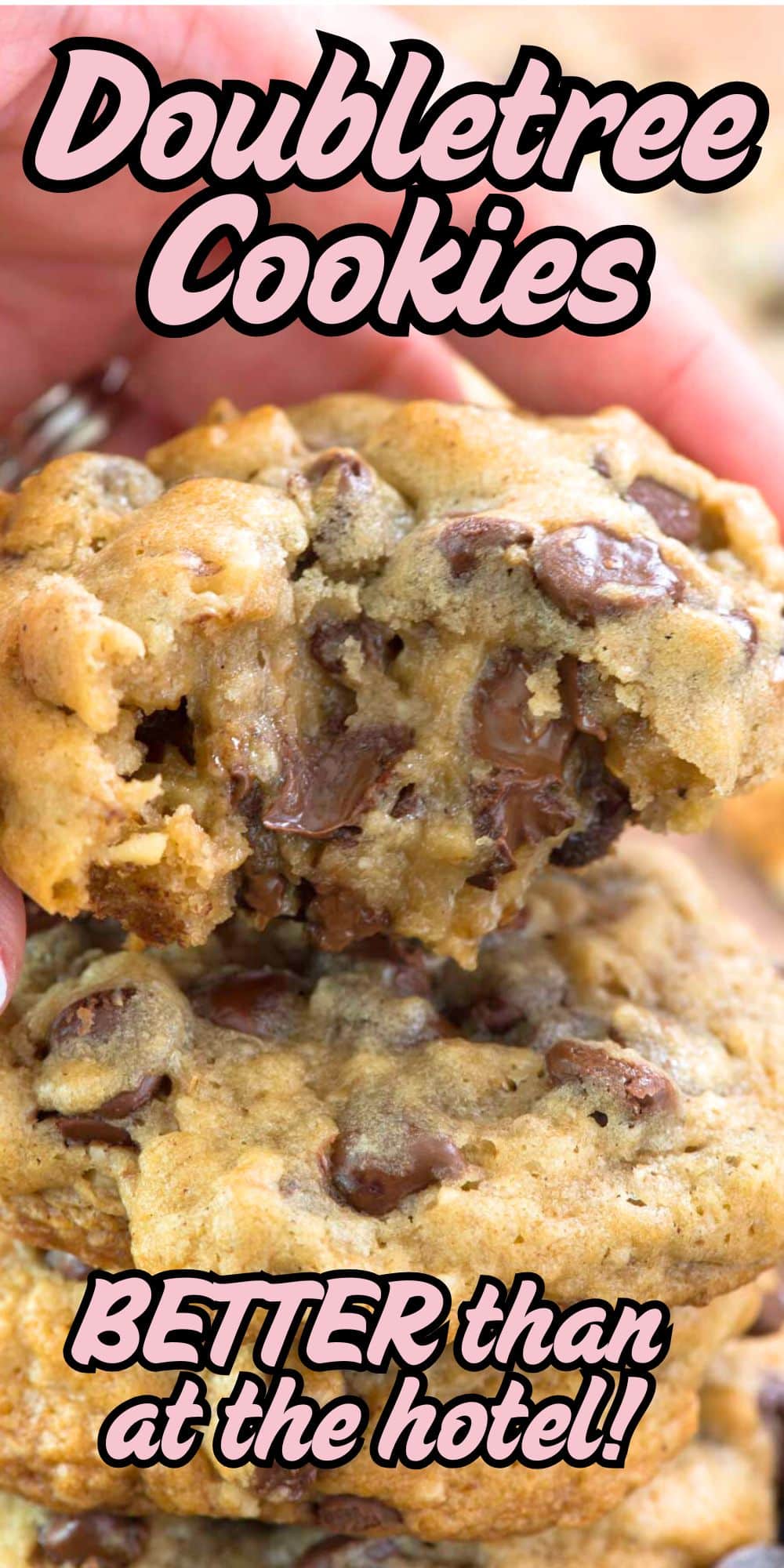 A close-up of gooey Doubletree Chocolate Chip Cookies with melted chocolate, held by hand. Text reads: Doubletree Cookies. BETTER than at the hotel!.