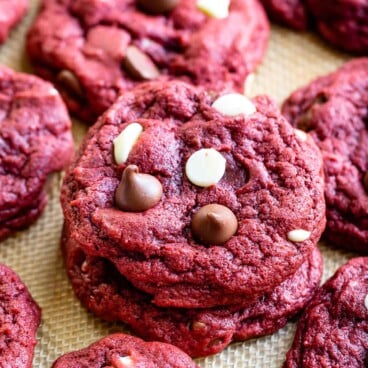 Stack of red velvet cookies with more cookies around it