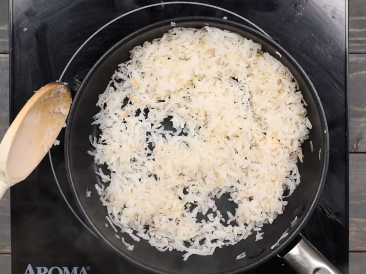 process shot of toasted coconut being made.