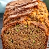 sliced banana bread with shredded zucchini baked inside.